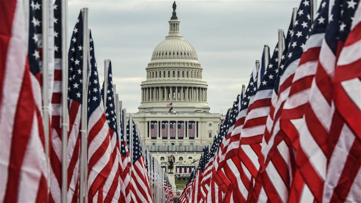 WASHINGTON, DC - JANUARY 19: The Capitol building is surrounded by American flags on the National Mall on January 19, 2021 in Washington, DC. Tight security measures are in place for Inauguration Day due to greater security threats after the attack on the U.S. Capitol on January 6. (Photo by Stephanie Keith/Getty Images)