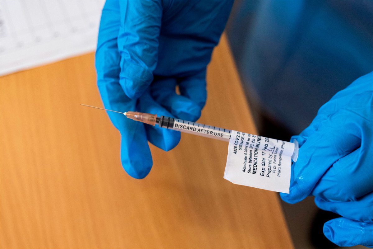 TOPSHOT - A health worker holds the Johnson and Johnson vaccine at the Chris Hani Baragwanath Hospital in Soweto in February 17, 2021. (Photo by Emmanuel Croset / AFP) (Photo by EMMANUEL CROSET/AFP via Getty Images)
