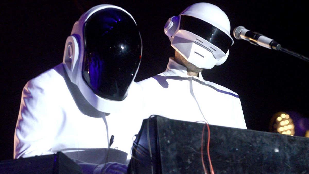 INDIO, CA - APRIL 20: Guests dressed as Daft Punk performs with Arcadw Fire at the Coachella Valley Music and Arts Festival at The Empire Polo Club on April 20, 2014 in Indio, California. (Photo by Tim Mosenfelder/WireImage)
