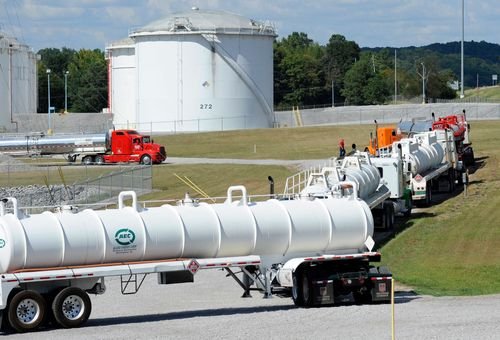 FILE - This Sept. 16, 2016, file photo shows tanker trucks lined up at a Colonial Pipeline Co. facility in Pelham, Ala., near the scene of a 250,000-gallon gasoline spill caused by a ruptured pipeline. The Georgia-based company has filed a federal lawsuit blaming an Alabama-based contractor, Ceco Pipeline Services, for the spill. (AP Photo/Jay Reeves, File)