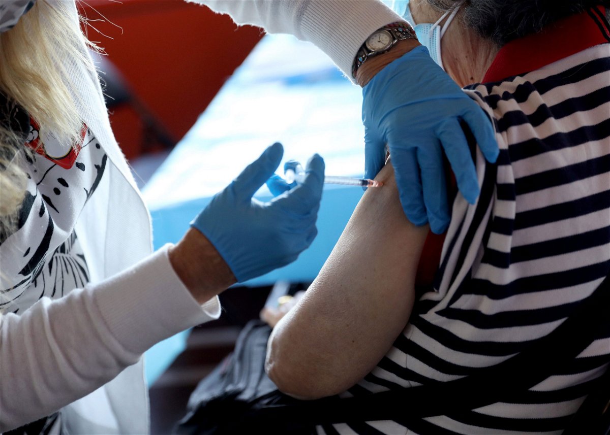 NEW YORK, NEW YORK - JUNE 18: A healthcare worker administers the vaccine as the Empire State Building Offers COVID-19 Vaccines at its Observatory on June 18, 2021 in New York City. (Photo by Monica Schipper/Getty Images for Empire State Realty Trust, Inc.)