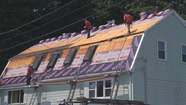 <i>WBZ</i><br/>Workers put a new roof on Admira Depina's roof in Randolph.