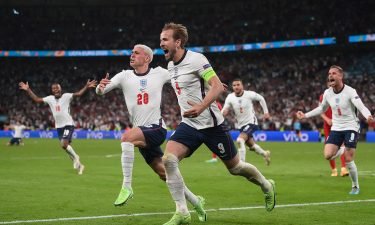 England's forward Harry Kane celebrates after scoring a goal during the UEFA EURO 2020 semi-final football match between England and Denmark in London on July 7. Goldman Sachs predicts that England has a 58% chance of defeating Italy in the Euro 2020 final.
