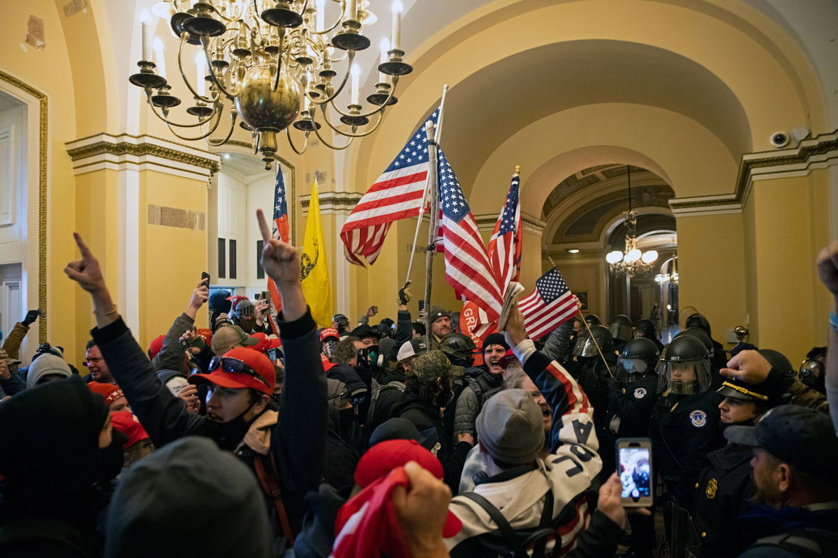 <i>Brent Stirton/Getty Images</i><br/>Supporters of then-President Donald Trump protest inside the US Capitol on January 6 in Washington