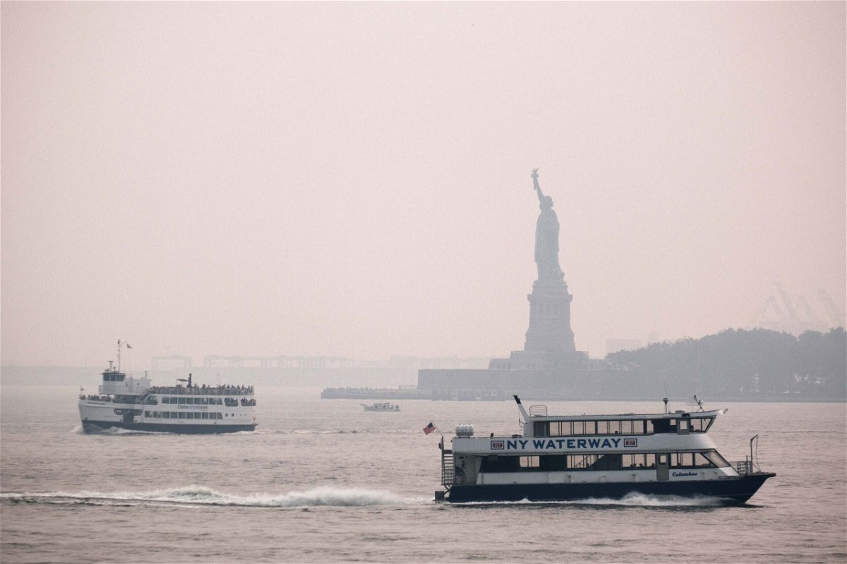 <i>Spencer Platt/Getty Images</i><br/>The Statue of Liberty sits behind a cloud of haze on July 20