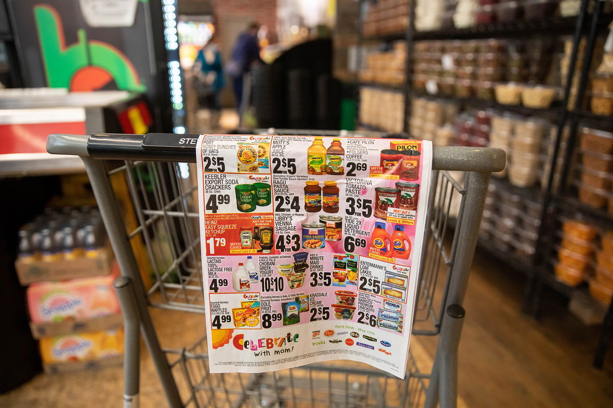 <i>Michael Nagle/Xinhua/Getty Images</i><br/>An advertisement displays grocery items on sale at Steve's 9th Street Market in the Brooklyn borough of New York