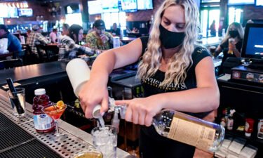 Bartender Olivia Imes prepares a drink for a customer at P.J. Whelihan's restaurant and pub in Spring Township