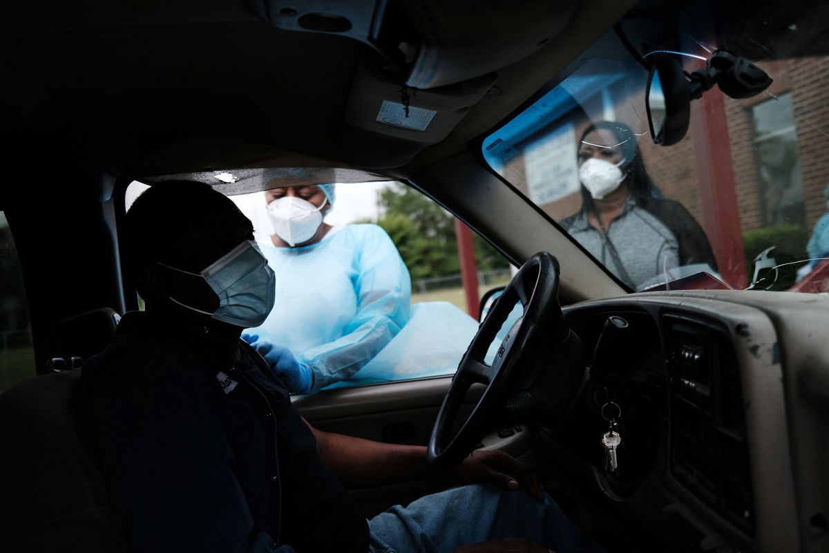 <i>Spencer Platt/Getty Images</i><br/>Medical workers prepare to vaccinate people at a pop-up Covid-19 vaccination clinic in Leland