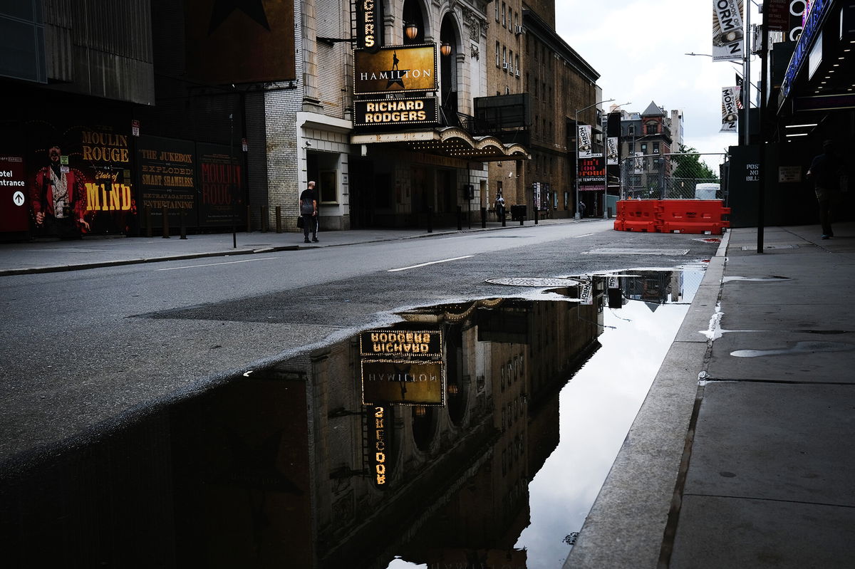 <i>Spencer Platt/Getty Images</i><br/>Owners and operators of all 41 Broadway theaters in New York City will require audience members and performers as well as staff to be vaccinated for all performances through the month of October. In this picture Broadway theaters are closed along an empty street in the theater district on June 30