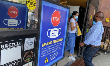 People shop at a grocery store enforcing the wearing of masks in Los Angeles on July 23. Top federal health officials have debated whether to issue new guidance on masks and are close to announcing their decision as the Delta variant fuels new outbreaks in the United States.