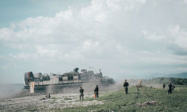 A US Navy landing craft brings US Marines ashore at the Naval Education Training Center