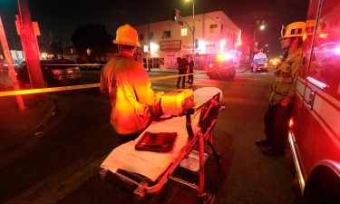 The remains of an armored Los Angeles Police Department tractor-trailer are seen after fireworks exploded Wednesday evening