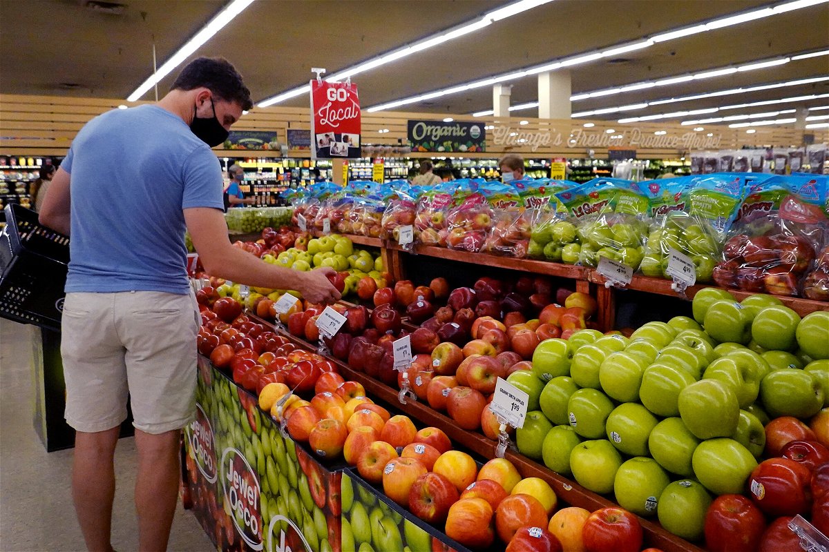 <i>Scott Olson/Getty Images</i><br/>Customers shop for produce at a supermarket on June 10 in Chicago
