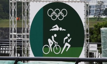 NBC faces a challenge producing Tokyo Games after spectators are barred from competitions. This image shows a pictograph of triathlon in Tokyo on July 6.