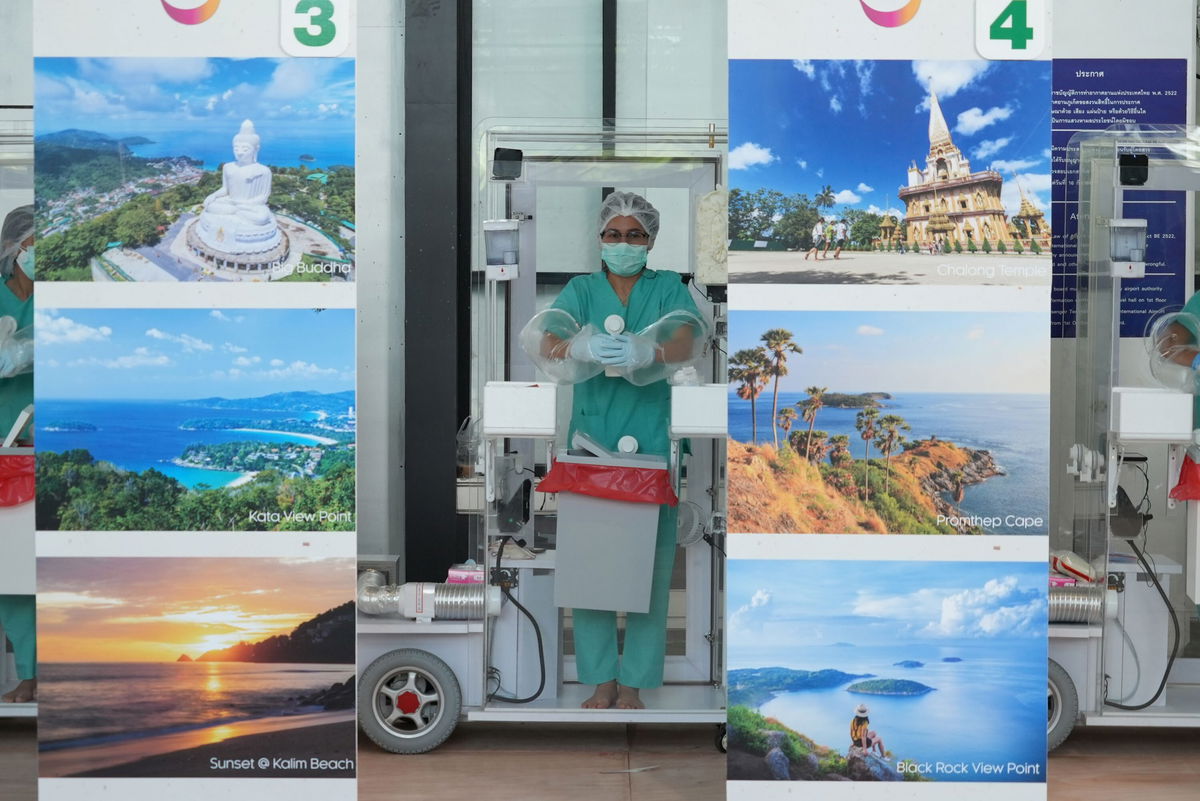 <i>Mark Phillips/CNN</i><br/>Phuket International Airport staff await incoming travelers on July 1.