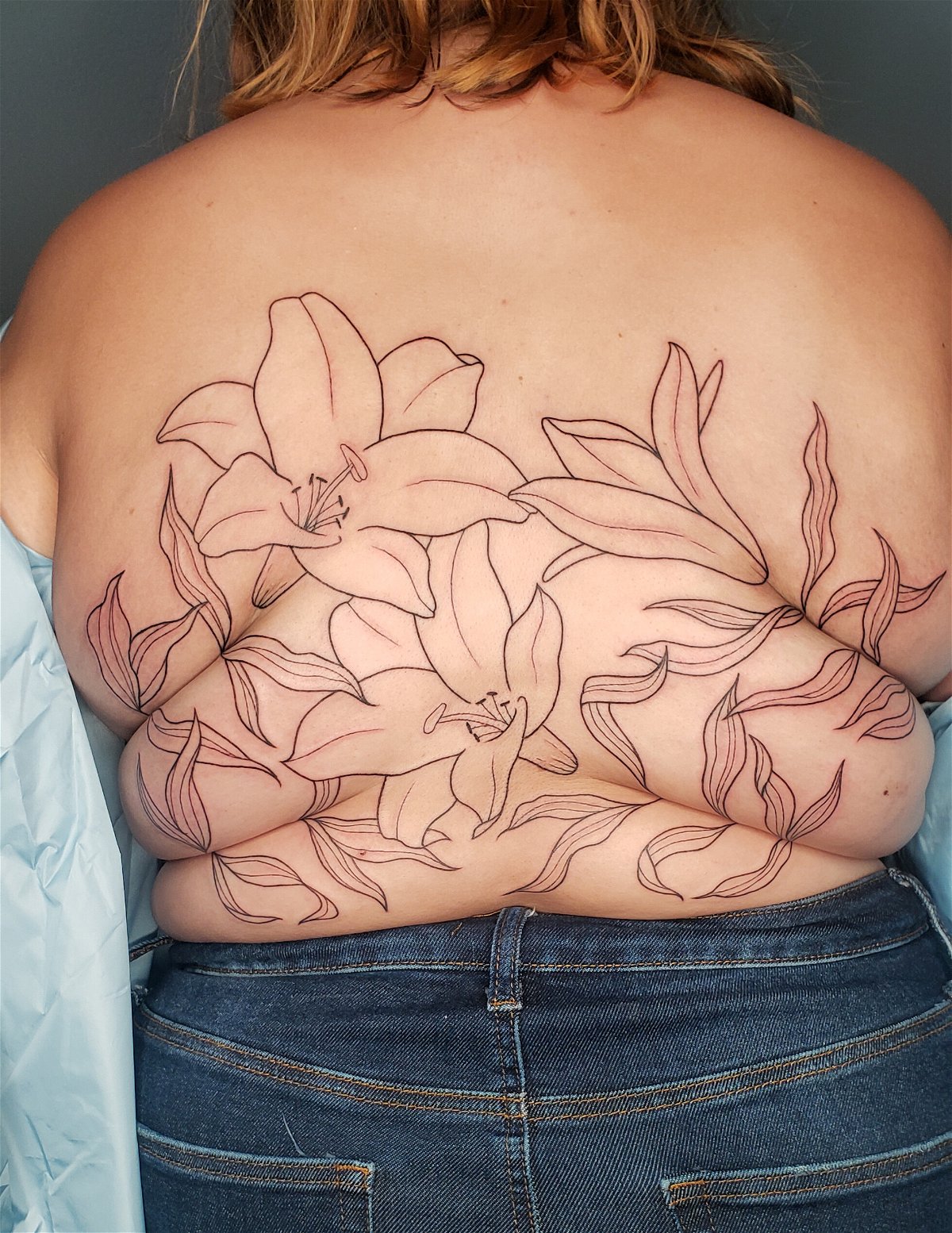 The tattooist creating body-positive 'roll flowers'
