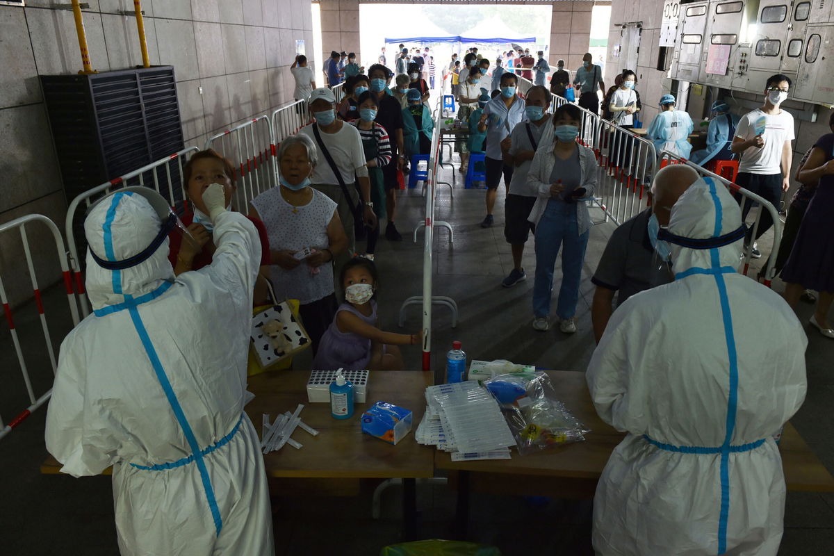 <i>Stringer/Imaginechina/AP</i><br/>The Delta variant is challenging China's zero Covid strategy. Citizens line up at a Covid-19 testing site in Yuhuatai district of Nanjing