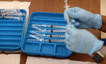 A healthcare worker prepares Moderna COVID-19 vaccines at a clinic on May 20