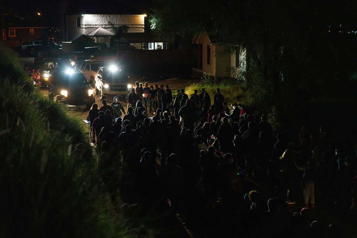 <i>Paul Ratje/AFP/Getty Images/FILE</i><br/>United States Border Patrol agents process migrants who crossed the US-Mexico border into the United States in Roma