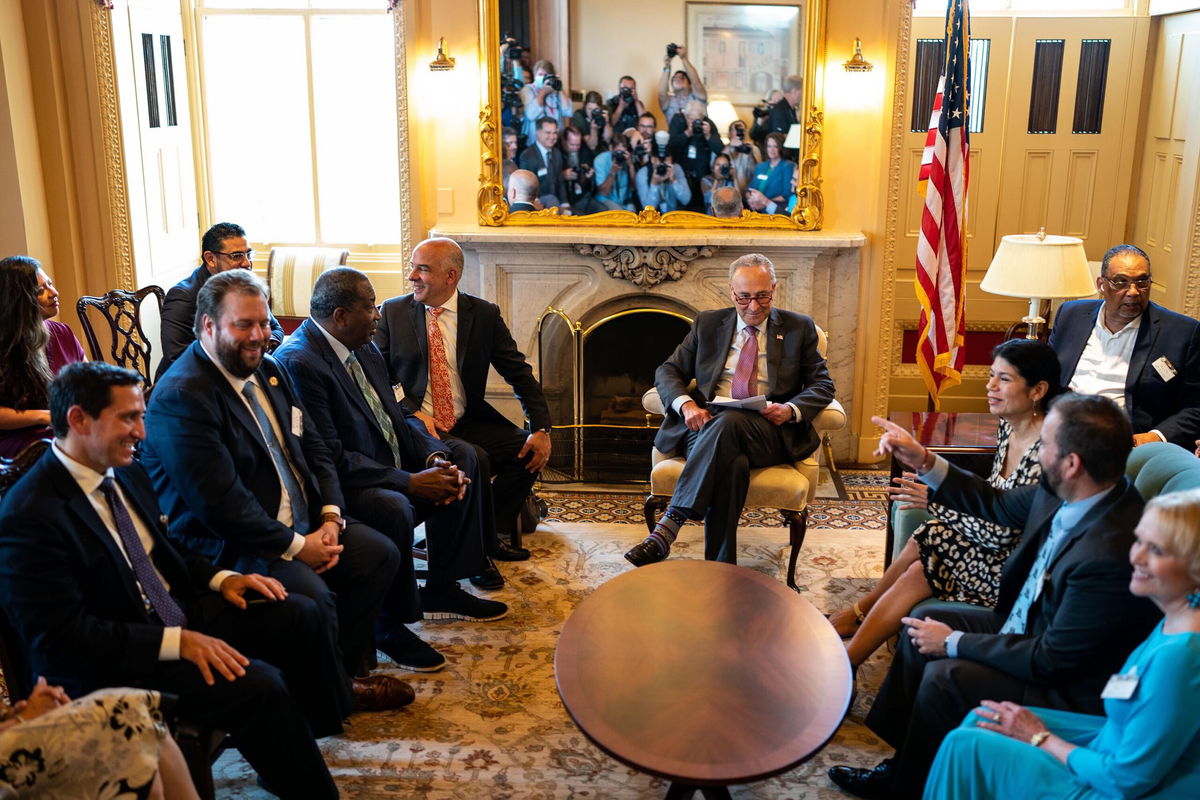 <i>Kent Nishimura/Los Angeles Times/Getty Images</i><br/>More than 100 state legislators will join Texas Democrats in Washington for voting rights pressure campaign. Senate Majority Leader Chuck Schumer here meets with Democratic members of the TX State Legislature at the US Capitol on July 13.