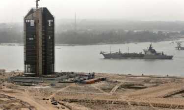 A cargo ship passes along a waterway during construction at the Eko Atlantic city site in February 2016.