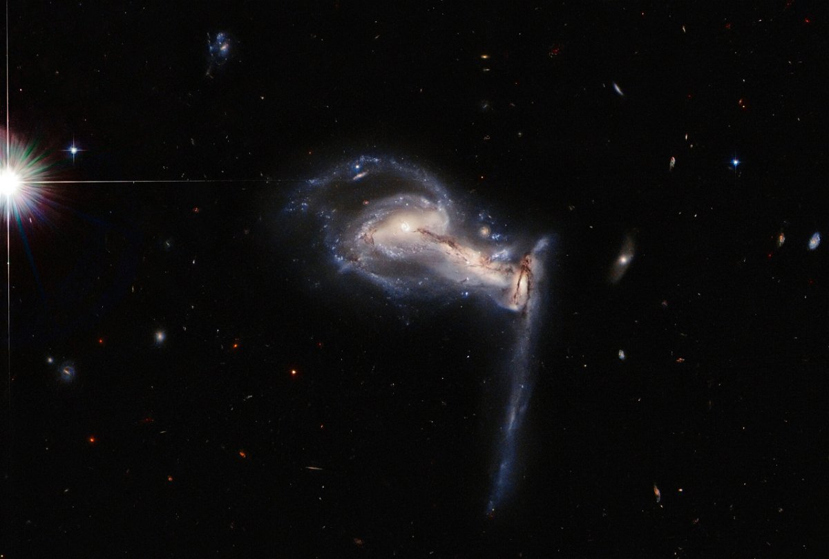 <i>ESA/Hubble/NASA/J. Dalcanton</i><br/>NASA/ESA Hubble Space Telescope captures a three-way gravitational tug-of-war between interacting galaxies.