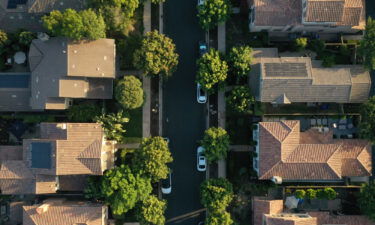 Wall Street is buying up family homes. This image shows an aerial photograph of single-family homes in San Diego