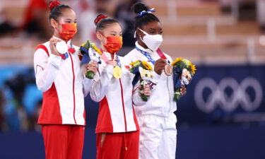 China's Guan Chenchen won gold in the women's balance beam final at the Tokyo Olympics as Simone Biles claimed a bronze.