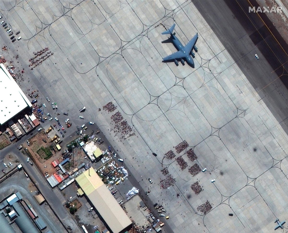 <i>Satellite image ©2021 Maxar Tec/AP</i><br/>Taliban members escorted Americans who sought to escape Afghanistan to gates at Kabul airport as part of a secret arrangement with the United States. Pictured is Kabul airport on August 23.