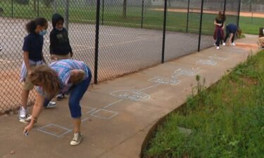 Koontz Intermediate teacher Delana Parker challenged her sixth-grade students to a game of hopscotch.