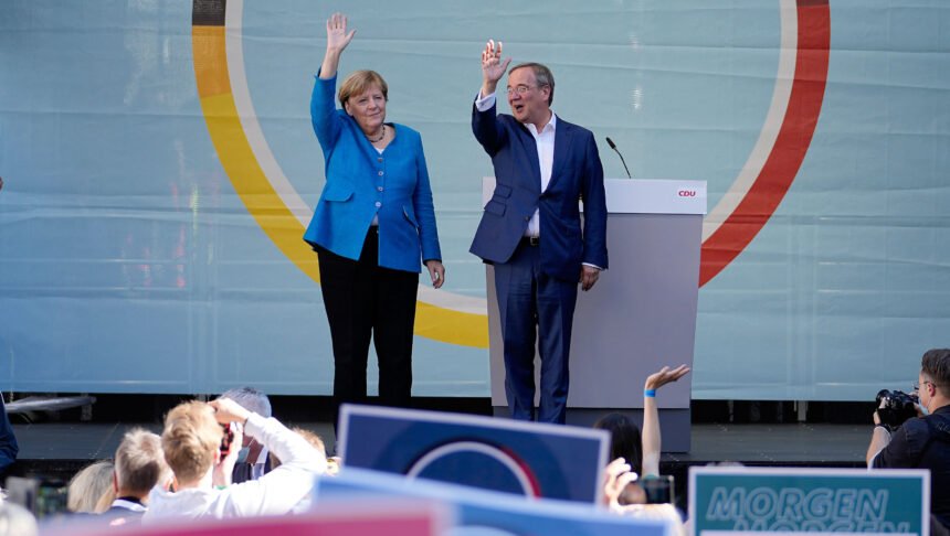 <i>Martin Meissner/AP</i><br/>Chancellor Angela Merkel and Armin Laschet