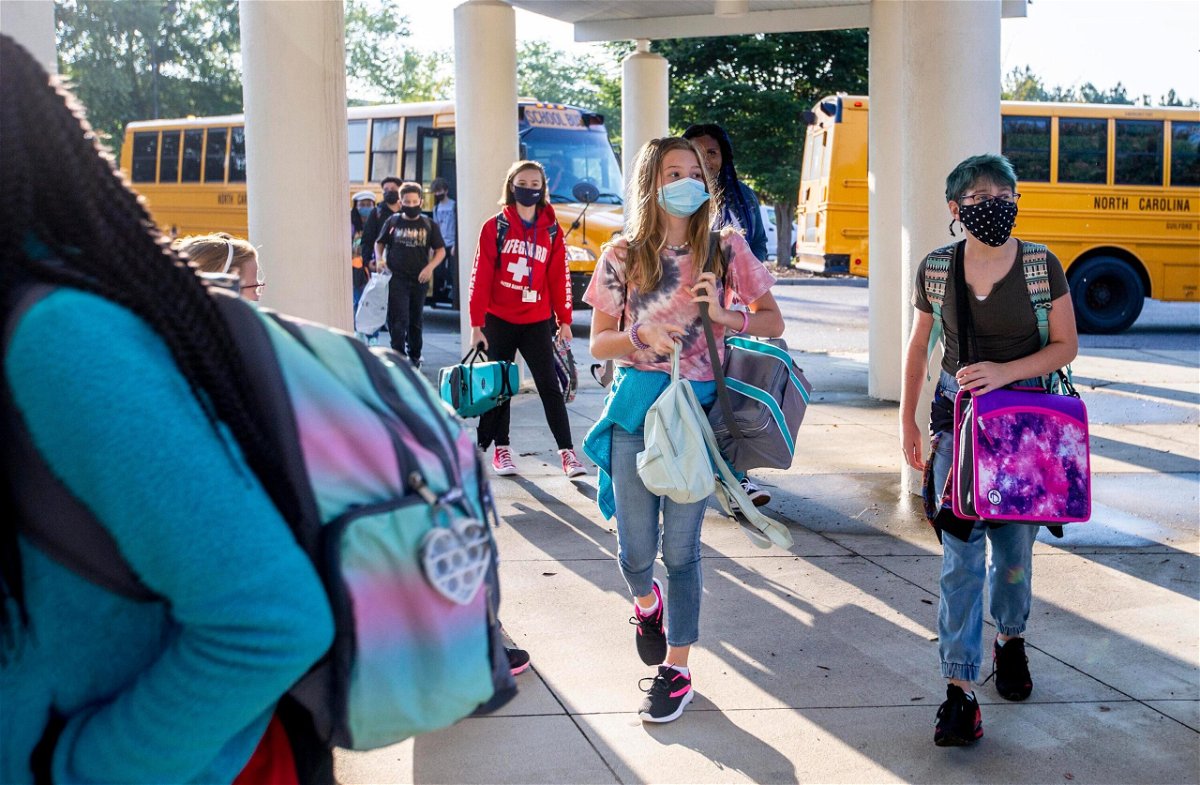 <i>Woody Marshall/News & Record/AP</i><br/>Students arrive by bus for the first day of school at Kernodle Middle School in Greensboro