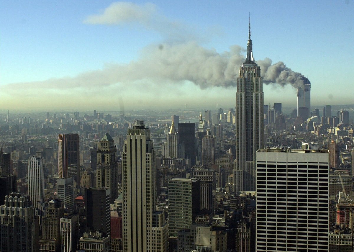 <i>Patrick Sison/AP</i><br/>Plumes of smoke pour from the World Trade Center buildings in New York Tuesday