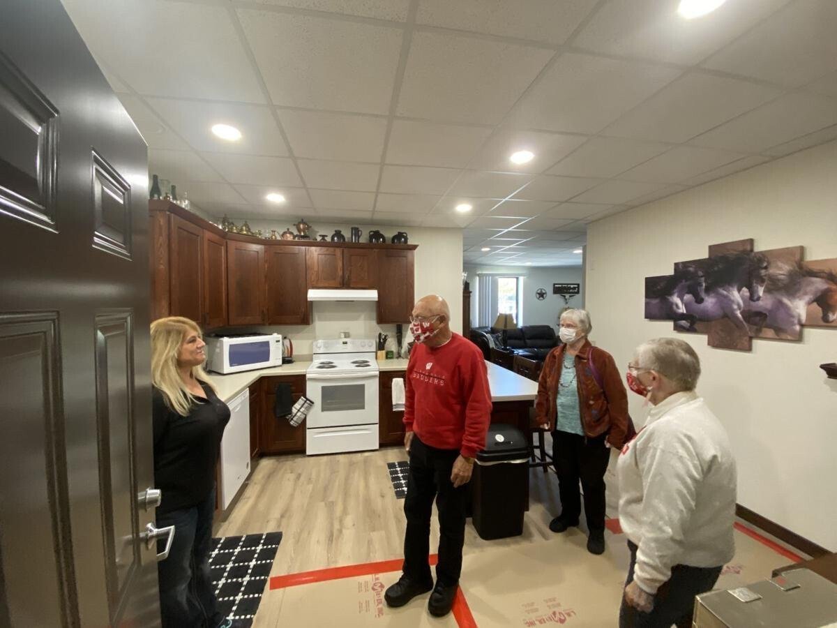 <i>Wisconsin State Journal</i><br/>Tina Amble (left) shows off her new apartment that is in a former second-grade classroom of a building that from 1968 to 2018 was home to Arena Elementary School.
