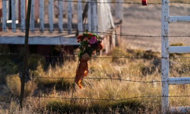 A bouquet of flowers honoring cinematographer Halyna Hutchins outside the Bonanza Creek Ranch in Santa Fe