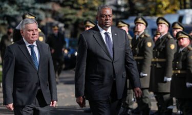 US Defense Secretary Lloyd Austin (right) on October 19 called on Russia to stop its occupation of Crimea and to halt its "persistent cyberattacks" against the United States. Austin is seen with Ukrainian Defense Minister Andriy Taran in Kiev.