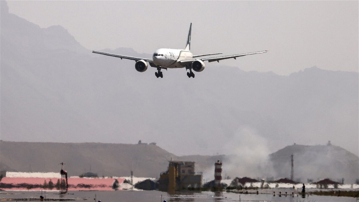 <i>Karim Sahib/AFP/Getty Images</i><br/>Pakistan International Airlines (PIA) announced Thursday that it was suspending flights to Afghanistan due to what it described as unworkable conditions imposed by the Taliban. A Pakistan International Airlines plane is shown landing at Kabul airport on September 13.