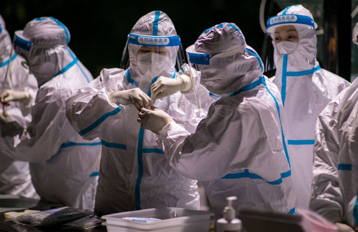 <i>Costfoto/Barcroft Media/Getty Images</i><br/>Authorities in northern China are reimposing lockdowns and other emergency measures to curb the spread of coronavirus. Medical workers are shown here working on the samples of Covid-19 nucleic acid test at a testing site in Hohhot