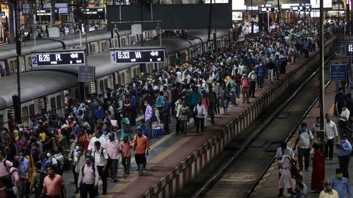 <i>Rajanish Kakade/AP</i><br/>Commuters wait for local trains during peak hours at Chhatrapati Shivaji Maharaj Terminus in Mumbai on September 30