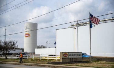96% of Tyson's active workers are vaccinated. A worker walks past the Tyson Foods Inc. processing plant in Center