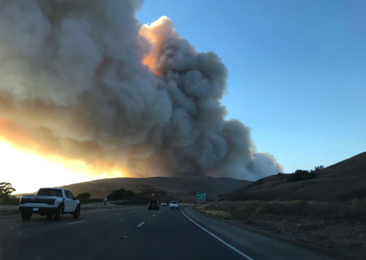 <i>Al Seib/Los Angeles Times/Getty Images</i><br/>Smoke fills the sky as the Alisal fire burns in the distance on Monday