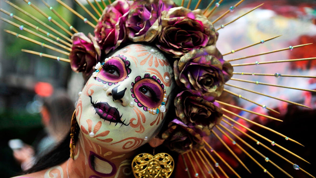 <i>Claudio Cruz/AFP/Getty Images</i><br/>A woman is seen dressed as Catrina takes part in the 