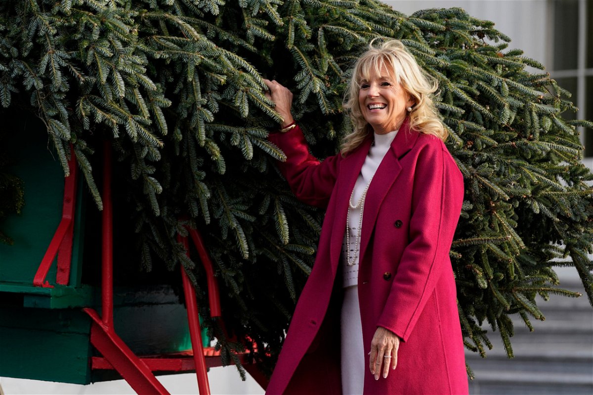 <i>Patrick Semansky/AP</i><br/>First lady Jill Biden receives the official 2021 White House Christmas tree at the White House on Nov. 22