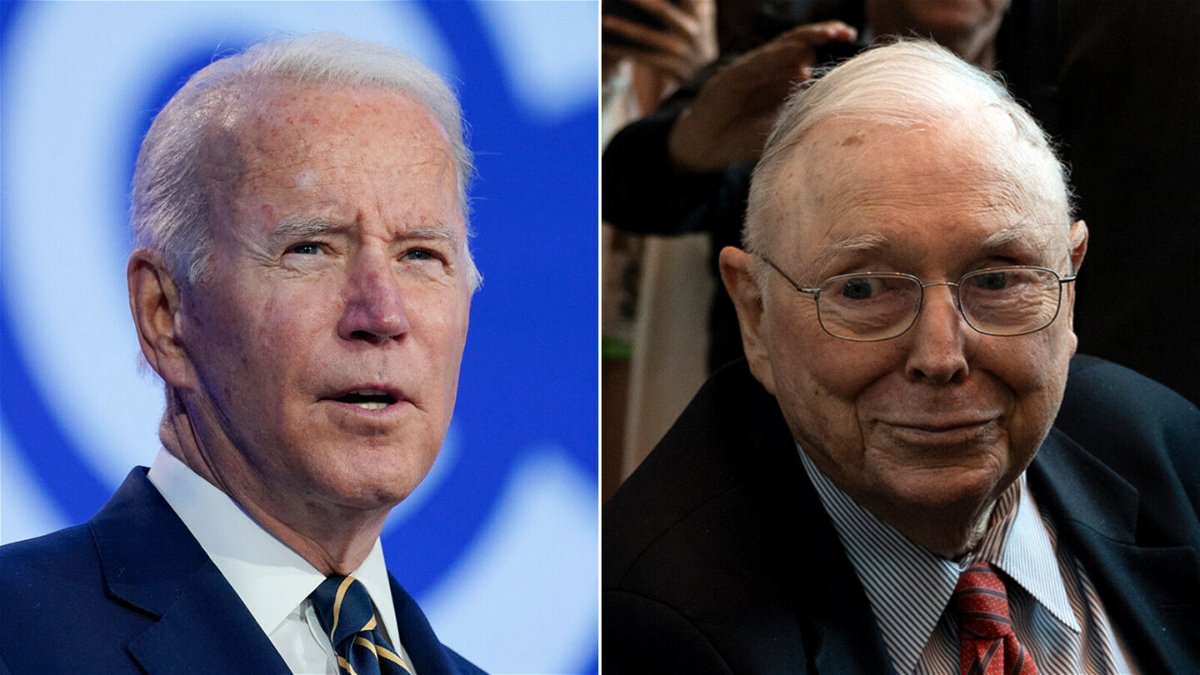 <i>Evan Vucci/Johannes Eisele/AFP/Getty Images</i><br/>Democrats want to tax stock buybacks to help pay for President Joe Biden's $1.75 trillion spending plan. Billionaire investor Charlie Munger isn't happy about it.