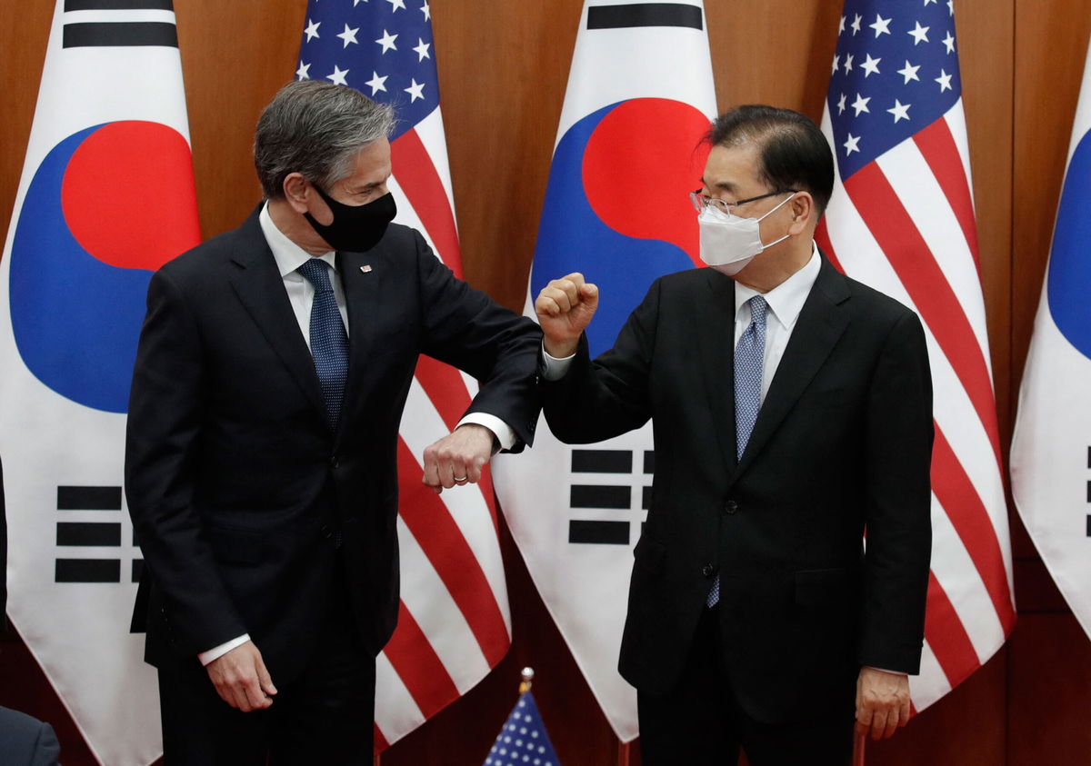 <i>Lee Jin-man/Pool/AFP/Getty Images</i><br/>US Secretary of State Antony Blinken (L) bumps elbows with South Korean Foreign Minister Chung Eui-yong in Seoul on March 18