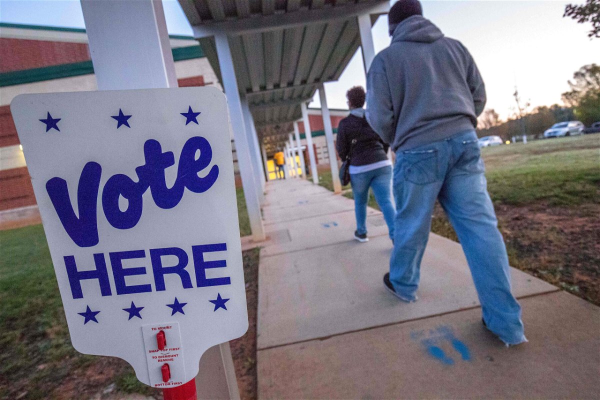 <i>Grant Baldwin/AFP/Getty Images</i><br/>Voters arrive at a polling place in Charlotte