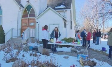Volunteers stand in front of the Community Christ Church in Longmont