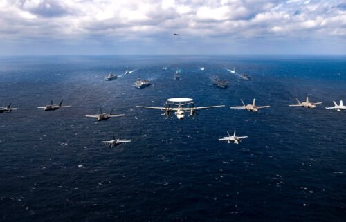 Aircraft fly over a US-Japan naval flotilla that included two US aircraft carriers in the Philippine Sea on January 22.