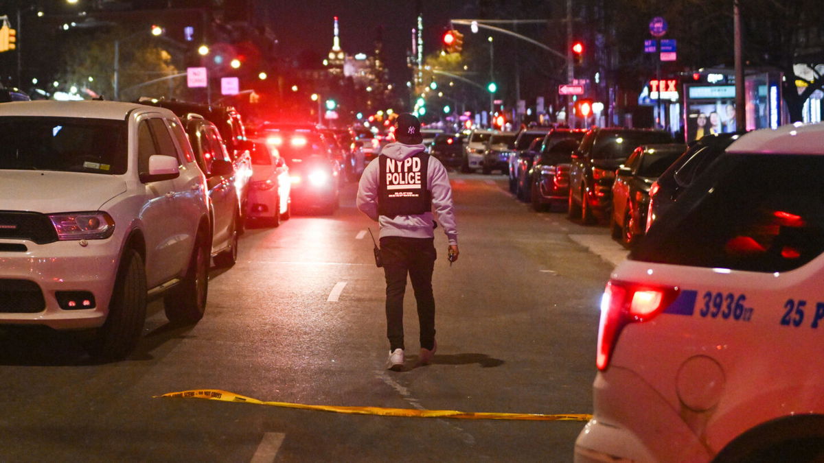 <i>Alexi Rosenfeld/Getty Images</i><br/>Police at the scene after two NYPD officers were shot in Harlem on January 21. The gun used to kill the officers was stolen in Baltimore five years ago