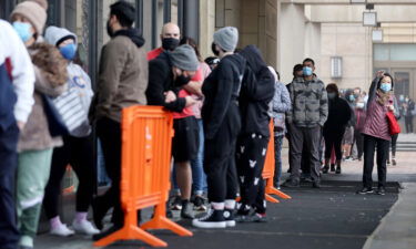 People wait in line to be tested for COVID-19 at Union Station on January 7